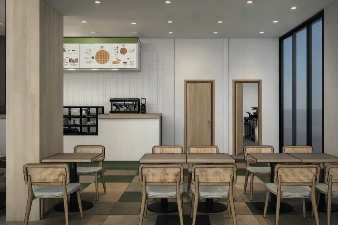 Salle aux tables en bois et chaises cannées, avec le comptoir et l’accès cuisine — vue 3D